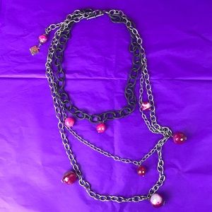 Long three chain necklace with pink beads